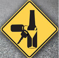 Bottle and keys on yield sign